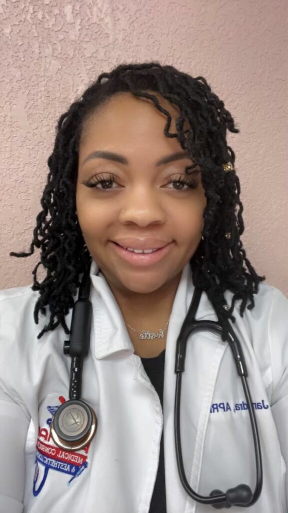 a smiling healthcare professional wearing a stethoscope and a white lab coat